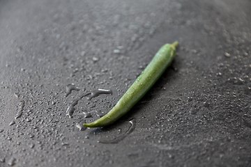 Image showing green chili pepper on slate stone background