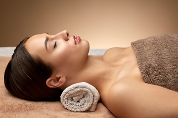 Image showing young woman lying at spa or massage parlor