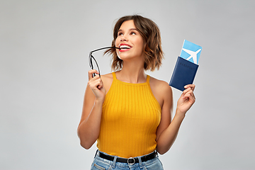 Image showing happy young woman with air ticket and passport