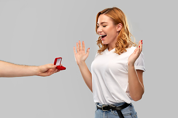 Image showing man giving woman engagement ring on valentines day