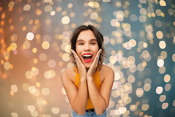 Image showing surprised young woman in yellow top