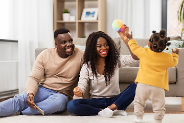 Image showing african family playing with baby daughter at home