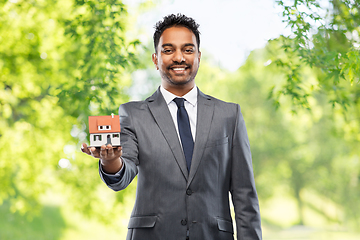 Image showing indian man realtor with house model