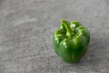 Image showing close up of green pepper on slate stone background