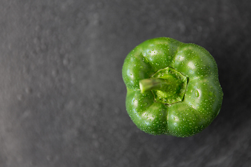 Image showing close up of green pepper on slate stone background