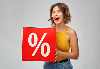 Image showing happy smiling young woman with sale signs