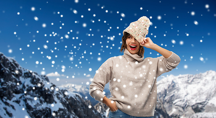 Image showing young woman in knitted winter hat and sweater