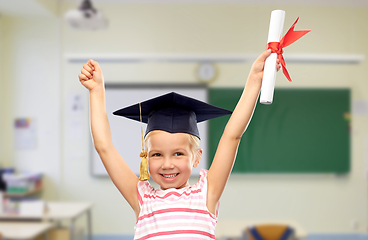 Image showing happy little girl in mortarboard with diploma