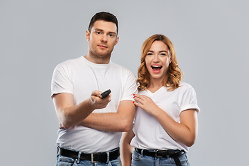 Image showing couple with tv remote control