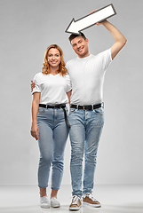 Image showing happy couple in white t-shirts with arrow to left