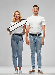 Image showing happy couple in white t-shirts with arrow to right