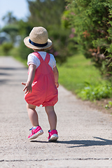 Image showing little girl runing in the summer Park