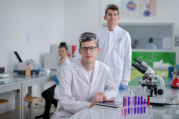 Image showing Group of young medical students doing research