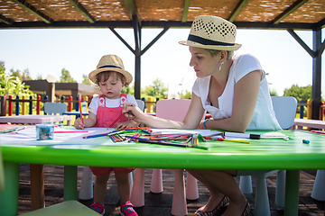 Image showing mom and little daughter drawing a colorful pictures