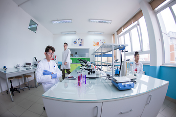 Image showing Group of young medical students doing research