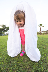 Image showing mother and little daughter playing at backyard