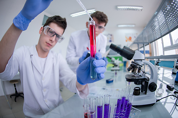 Image showing Group of young medical students doing research