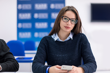 Image showing female student using a mobile phone