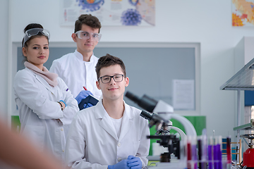 Image showing Group of young medical students doing research