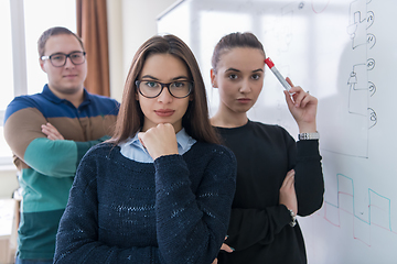 Image showing portrait of young students in front of chalkboard