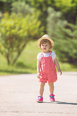 Image showing little girl runing in the summer Park