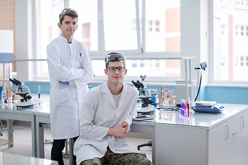 Image showing Group of young medical students doing research