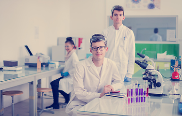 Image showing Group of young medical students doing research