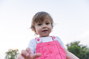 Image showing little girl spending time at backyard