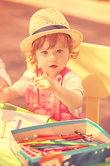 Image showing little girl drawing a colorful pictures