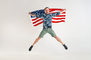 Image showing Young man with the flag of United States of America