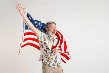 Image showing Senior man with the flag of United States of America