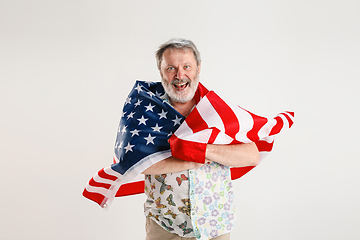 Image showing Senior man with the flag of United States of America