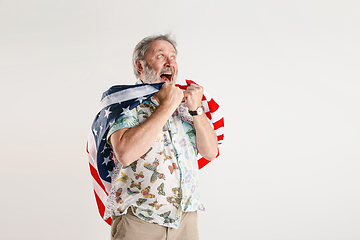 Image showing Senior man with the flag of United States of America