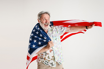 Image showing Senior man with the flag of United States of America