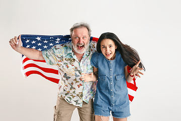 Image showing Senior man with the flag of United States of America