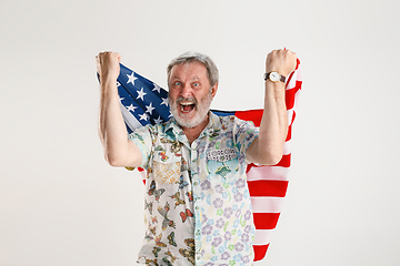 Image showing Senior man with the flag of United States of America