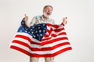 Image showing Senior man with the flag of United States of America