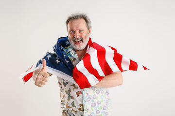 Image showing Senior man with the flag of United States of America