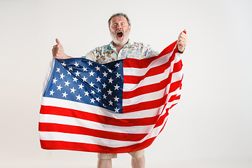 Image showing Senior man with the flag of United States of America