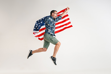 Image showing Young man with the flag of United States of America