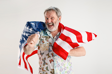 Image showing Senior man with the flag of United States of America