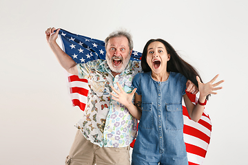 Image showing Senior man with the flag of United States of America