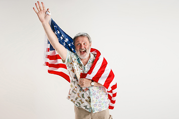 Image showing Senior man with the flag of United States of America