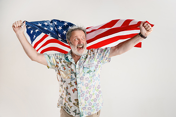 Image showing Senior man with the flag of United States of America