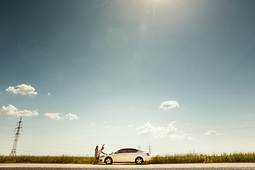 Image showing Young couple traveling on the car in sunny day