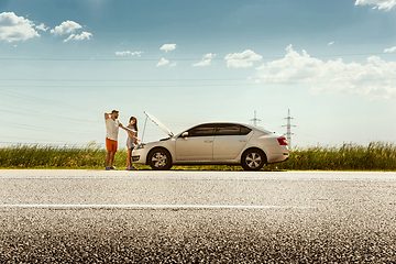 Image showing Young couple traveling on the car in sunny day