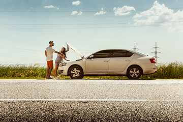 Image showing Young couple traveling on the car in sunny day