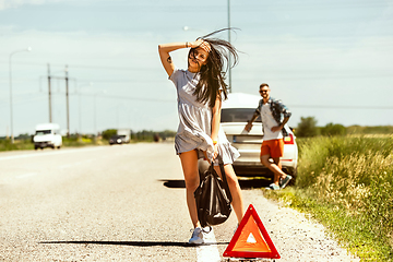 Image showing Young couple traveling on the car in sunny day