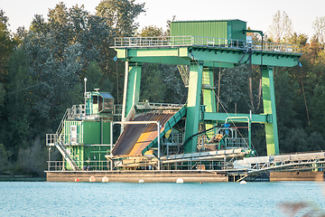 Image showing excavator for pebbles on a lake