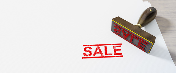 Image showing red stamp sale on white paper background